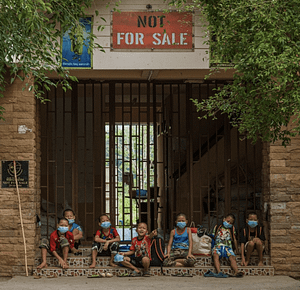 Children wait for their ride to school in the morning at Not For Sale Thailand