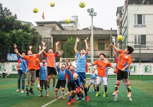 Children at Not For Sale's Vietnam project play soccer. 